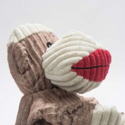 A side view of the HuggleHounds Stuey Sock Monkey Knottie® Plush Dog Toy.